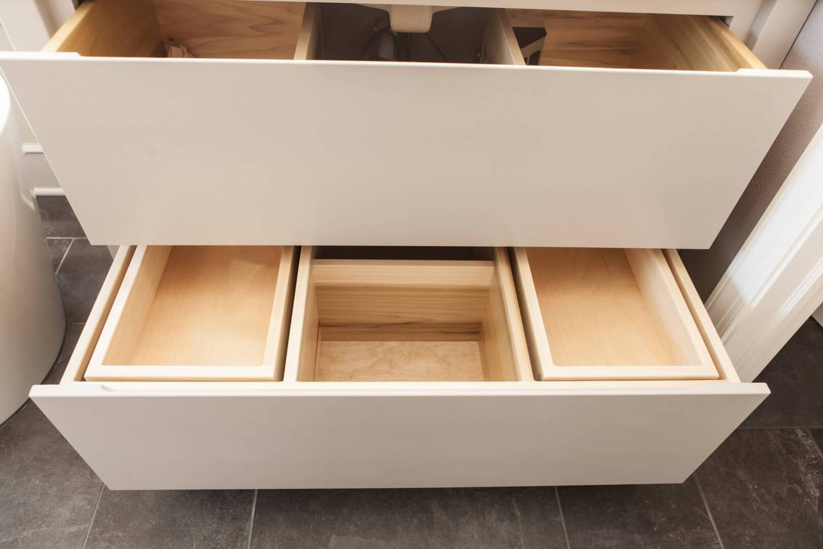 custom drawers pulled out on a master bathroom vanity