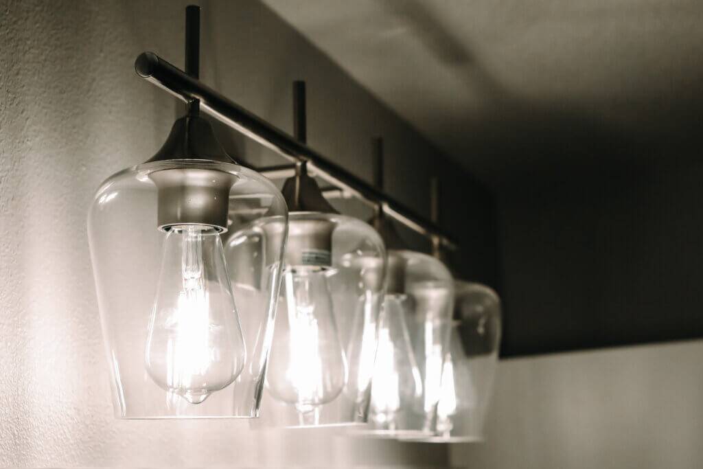 Bathroom light with Edison bulbs and glass covering