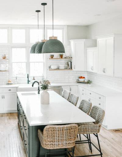 Overview of bright and neutral tones kitchen with white cabinets and counters
